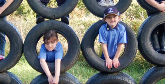 kids-hanging-on-a-tire